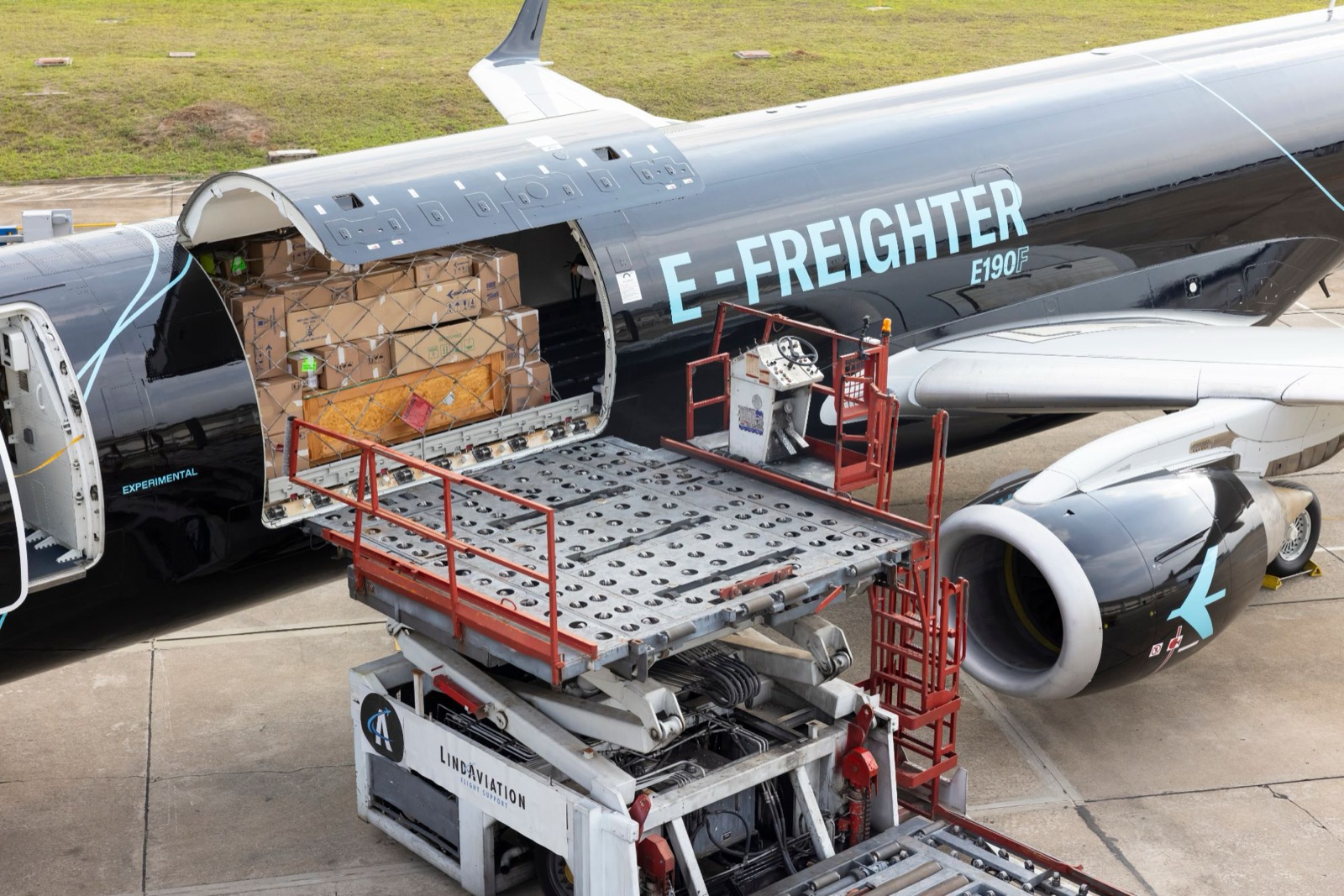 Cargo being loaded through the main-deck door of an E190F freighter